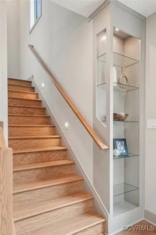 a bedroom with a large bed and a large window