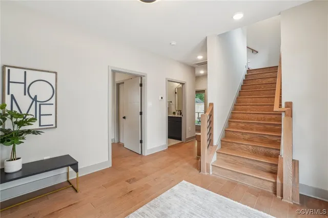 a view of entryway with wooden floor and window