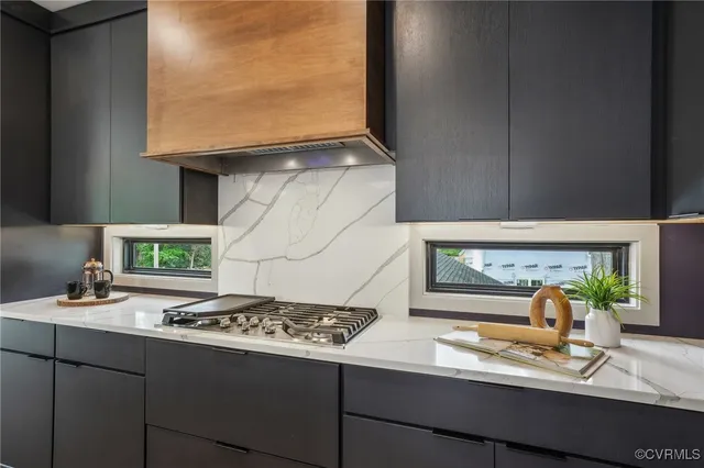 a kitchen with a stove and a sink