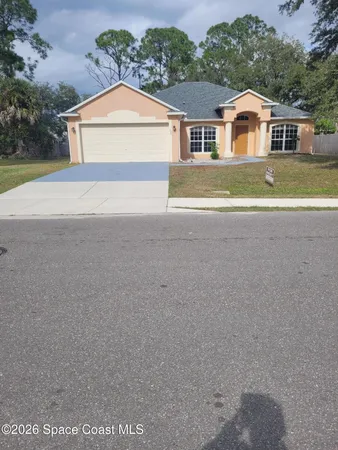 front view of house with a yard