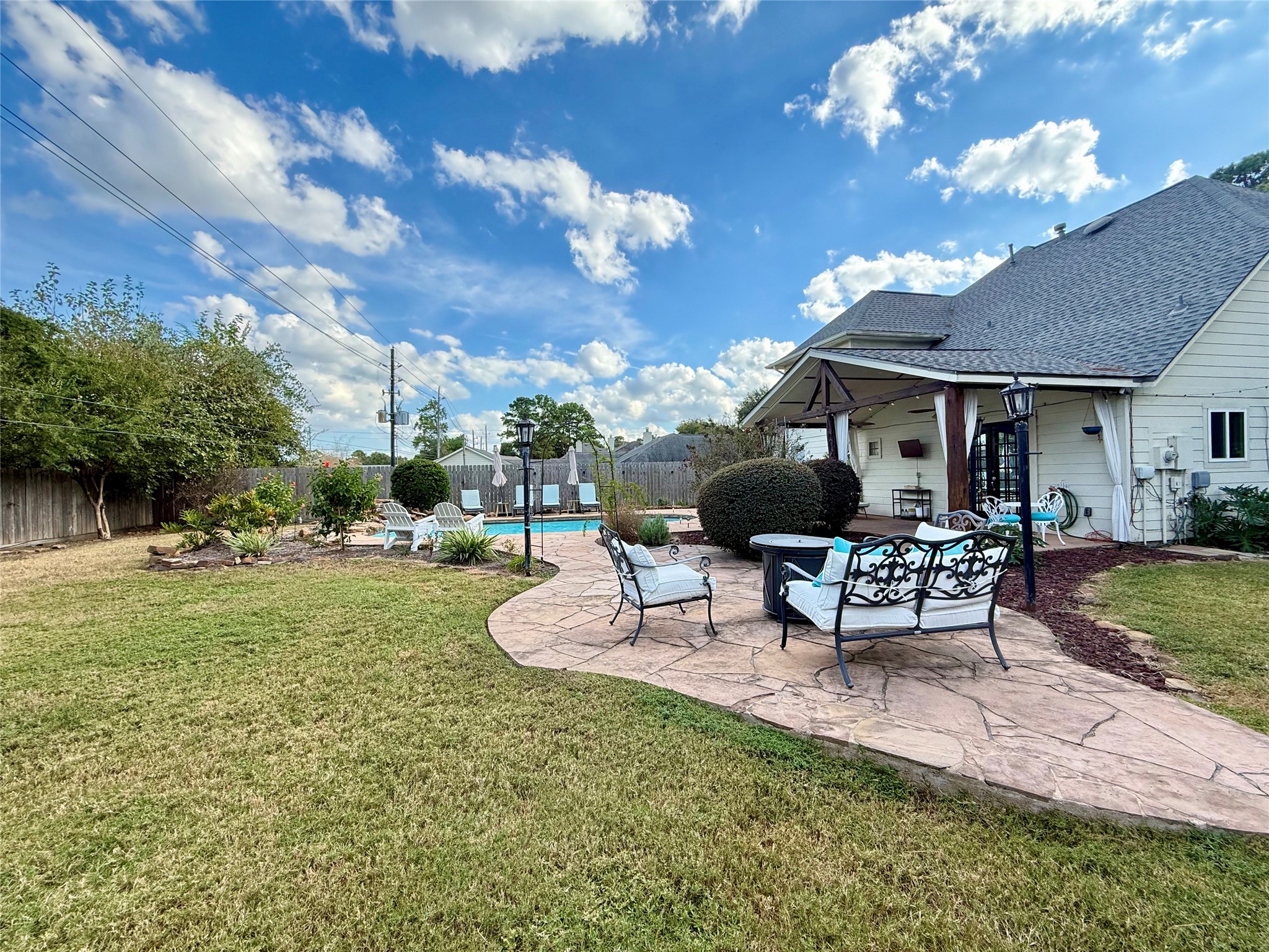 16902 Colony Creek Drive Spring, TX 77379 - Photo 17 of 18 a view of a backyard with sitting area