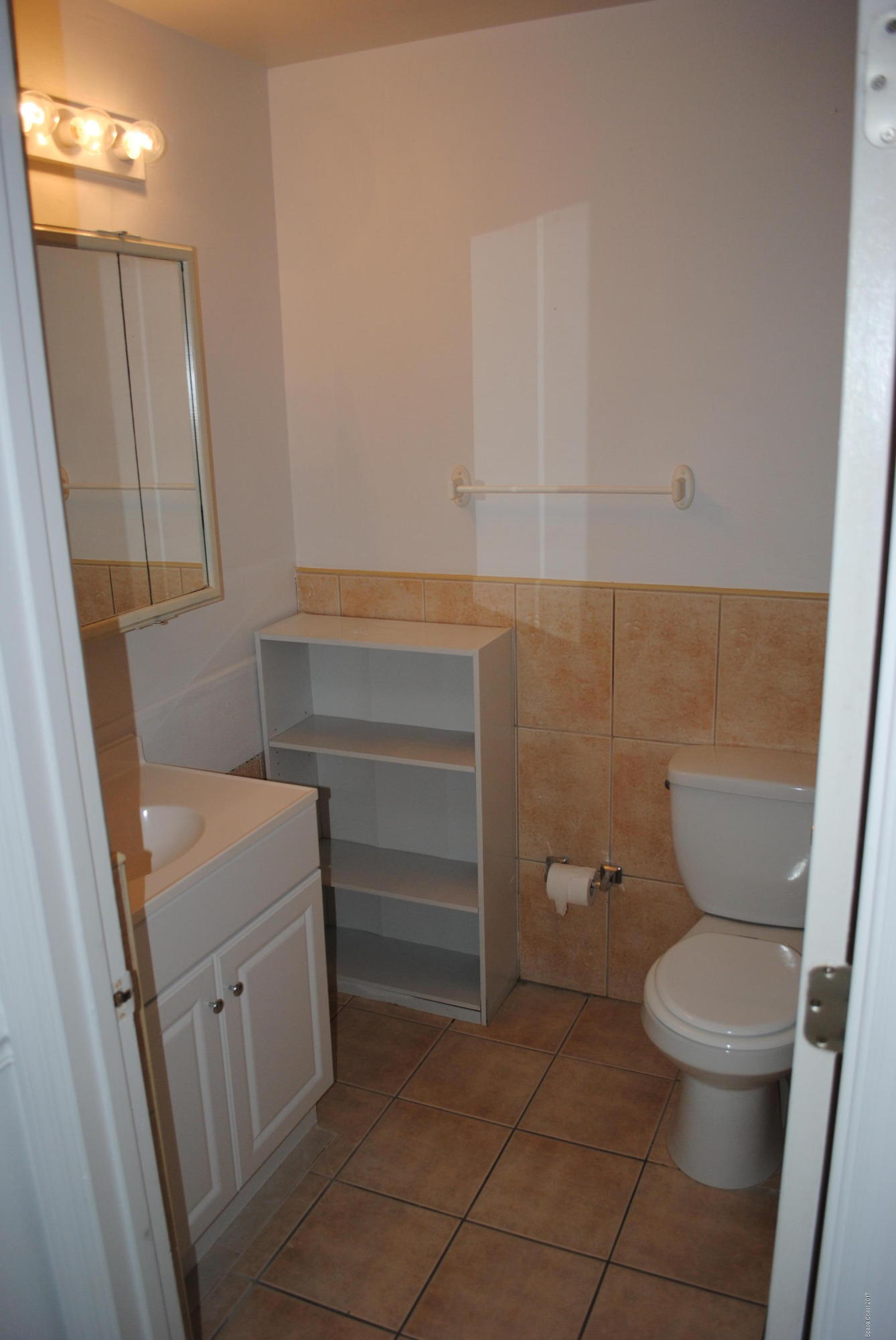 161 Tucson Road Southwest Palm Bay, FL 32908 - Photo 12 of 31 a bathroom with a toilet and a sink
