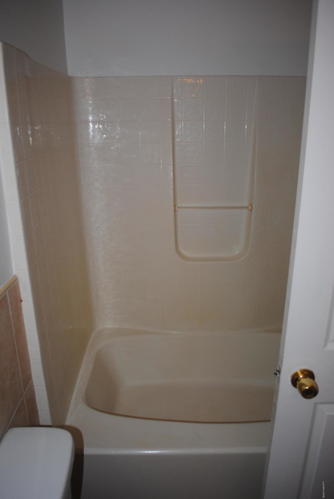 161 Tucson Road Southwest Palm Bay, FL 32908 - Photo 13 of 31 a bathroom with a shower