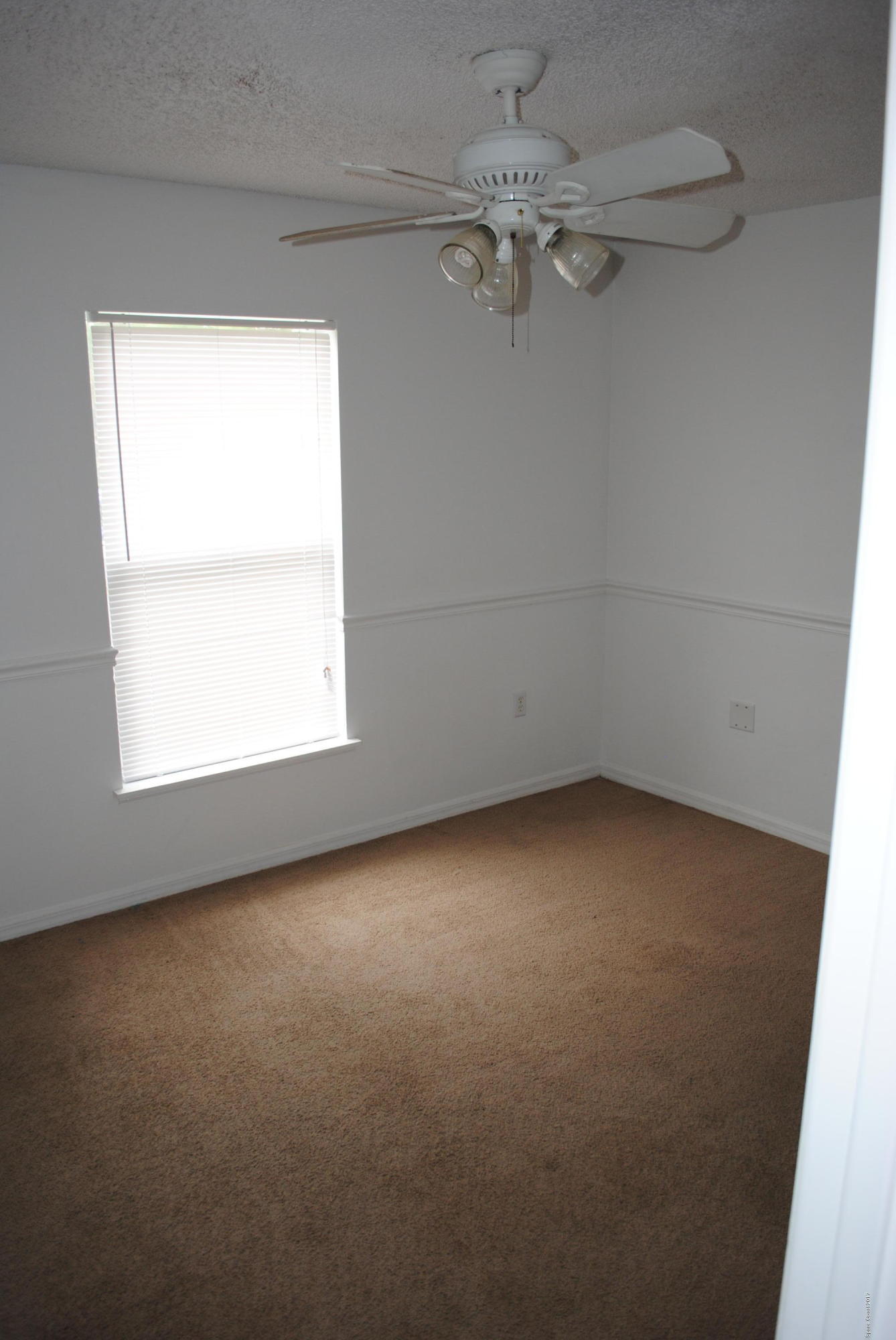 161 Tucson Road Southwest Palm Bay, FL 32908 - Photo 15 of 31 an empty room with a window