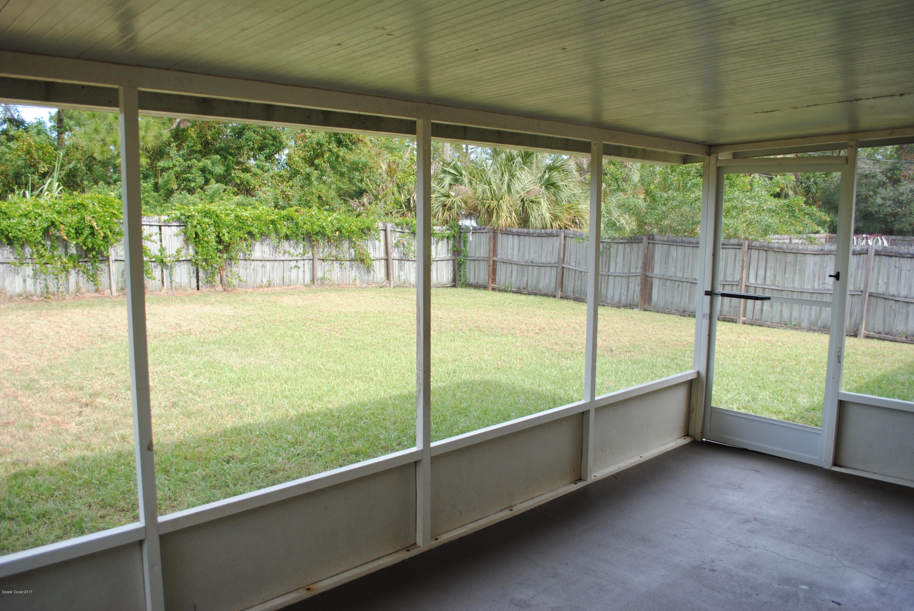 161 Tucson Road Southwest Palm Bay, FL 32908 - Photo 22 of 31 a view of an empty room with large windows