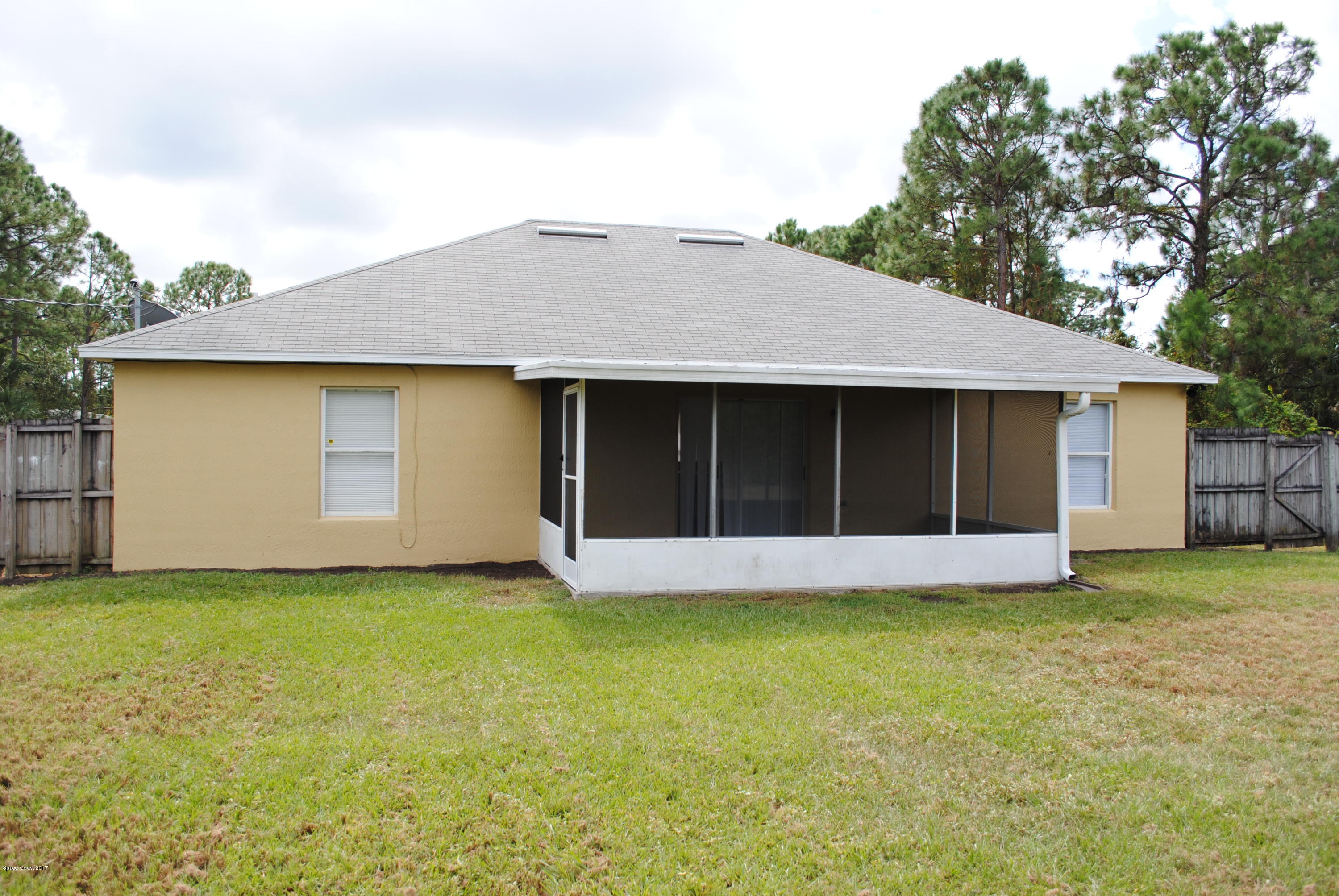 161 Tucson Road Southwest Palm Bay, FL 32908 - Photo 23 of 31 a view of a house with a garden