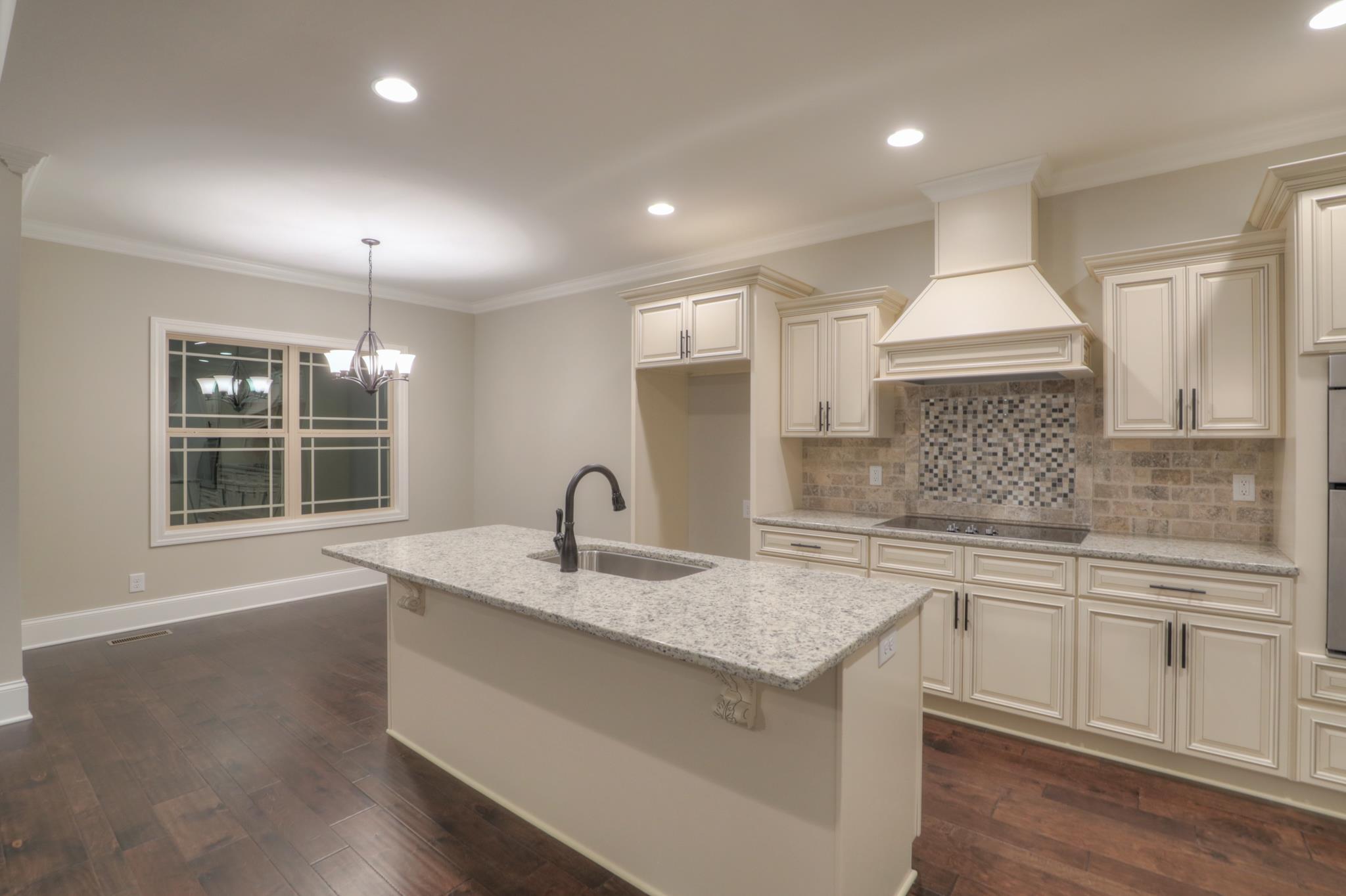 2211 Cairo Bend Road Lebanon, TN 37087 - Photo 11 of 29 a kitchen with a sink stove and cabinets