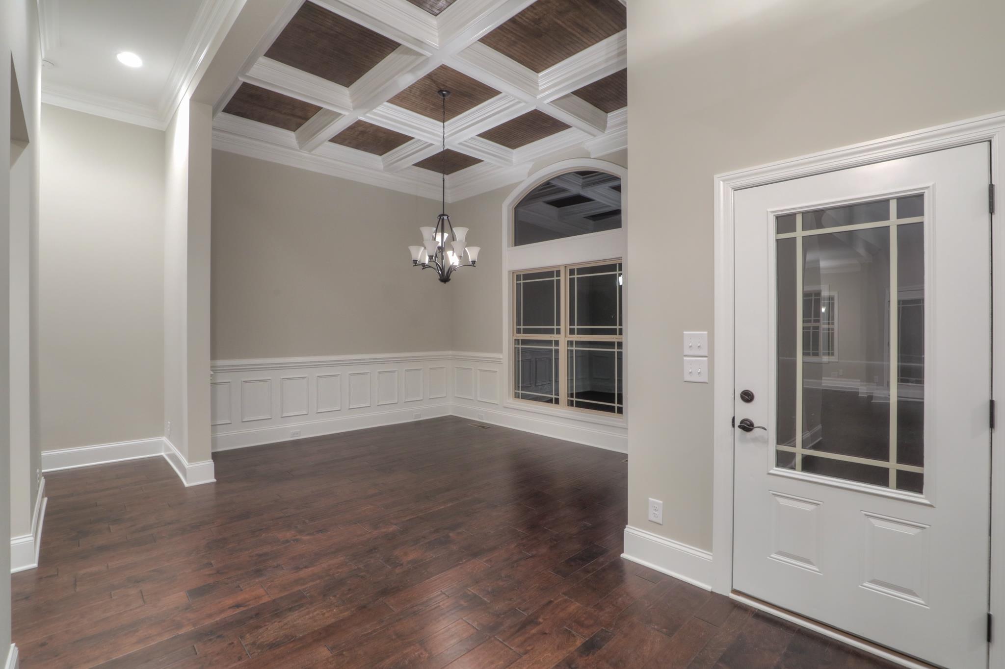 2211 Cairo Bend Road Lebanon, TN 37087 - Photo 5 of 29 an empty room with wooden floor and windows