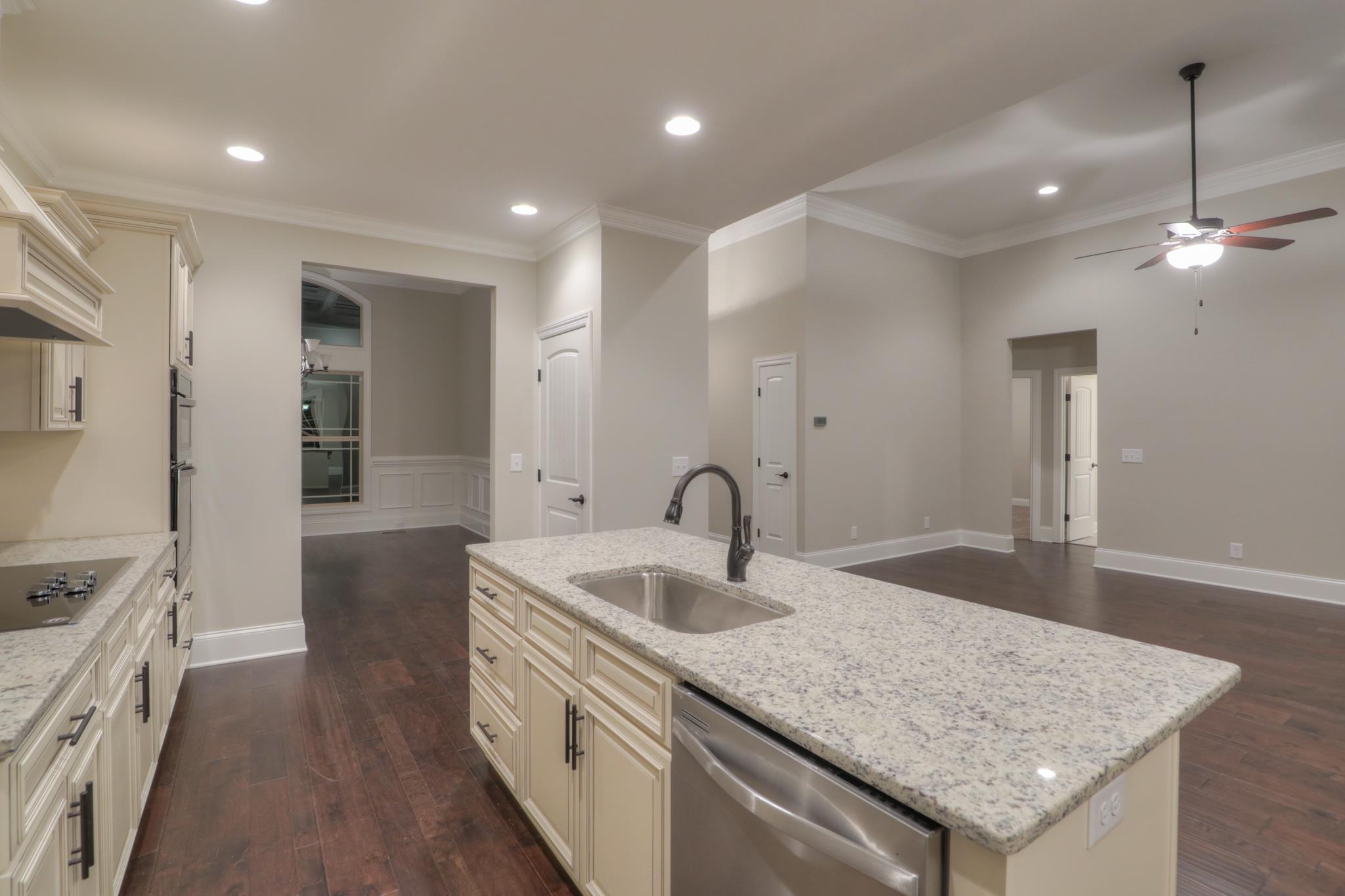2211 Cairo Bend Road Lebanon, TN 37087 - Photo 8 of 29 a kitchen with granite countertop a sink and a refrigerator