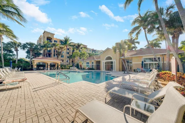a view of house with outdoor space and swimming pool