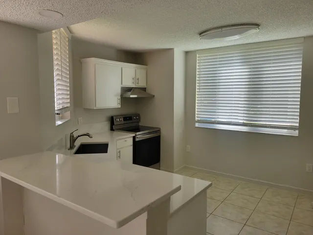 a kitchen with a white cabinets