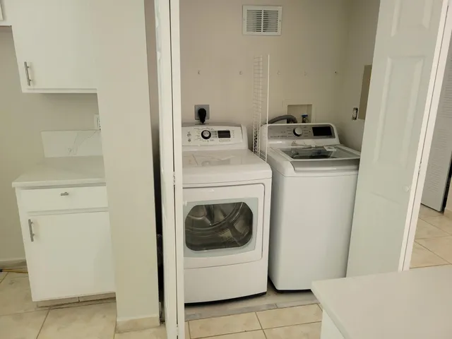 a utility room with dryer and washer