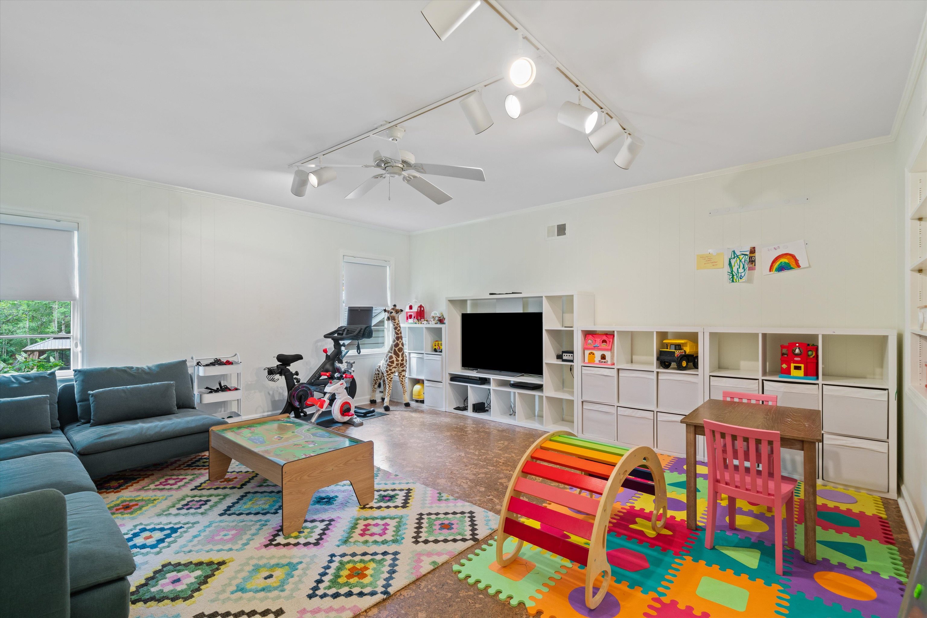 4391 Barfield Road Memphis, TN 38117 - Photo 22 of 25 a bed room with furniture and a flat screen tv