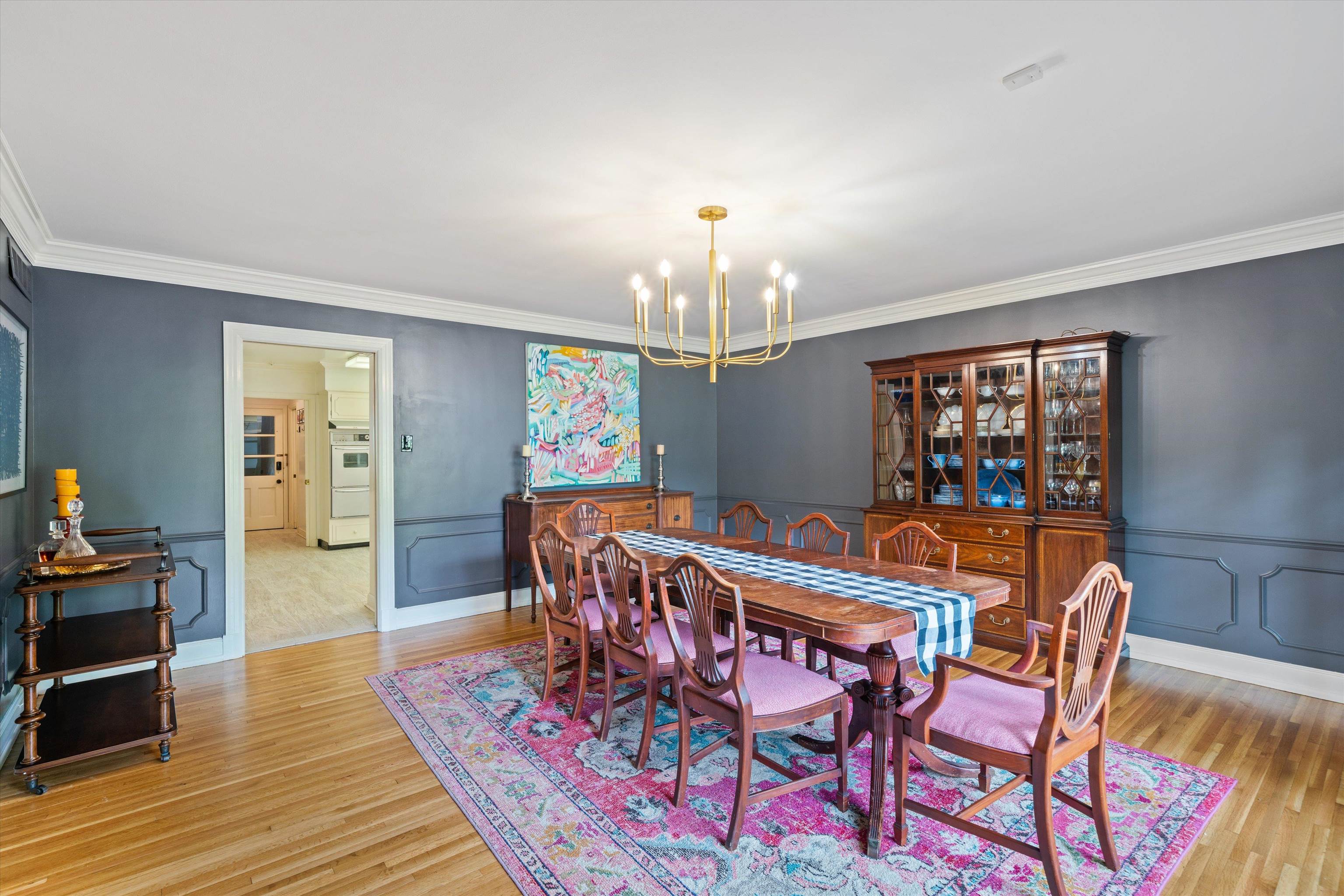 4391 Barfield Road Memphis, TN 38117 - Photo 5 of 25 a dining room with furniture a chandelier and wooden floor