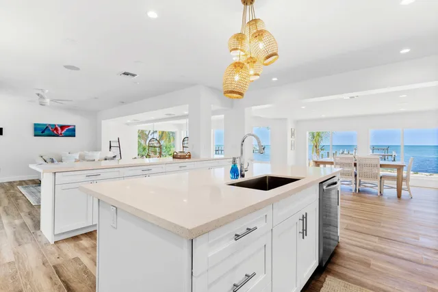 a spacious bedroom with a bed and a flat screen tv