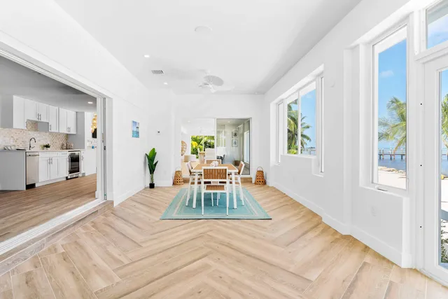 a spacious bedroom with a bed and a large window