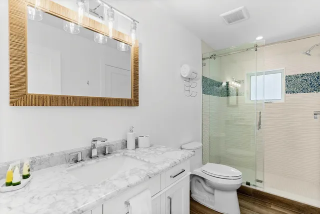 a spacious bedroom with a bed and a large window