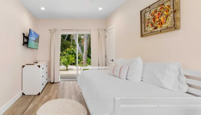 a row of palm trees next to a yard