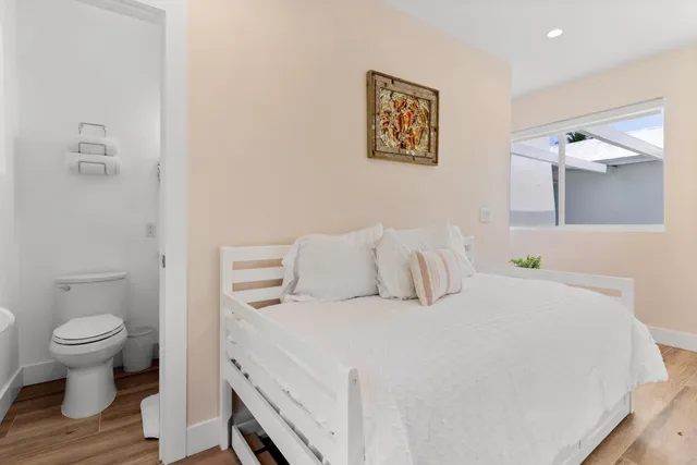 front view of a house with a yard and a garage