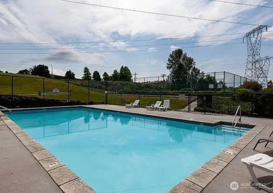 2020 Grant Avenue South, Unit A302 Renton, WA 98055 - Photo 21 of 22 a view of a swimming pool with lounge chair