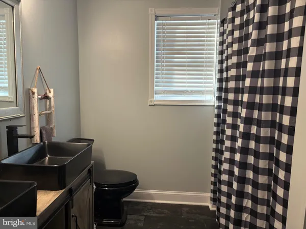 a room with a window and wooden floor