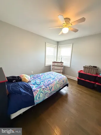 a bed room with a bed and a television