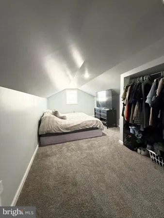 a view of room with furniture and cabinets