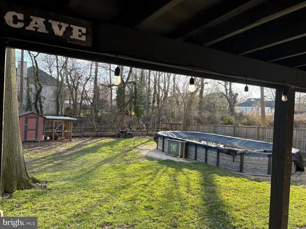 a house with swimming pool in front of it