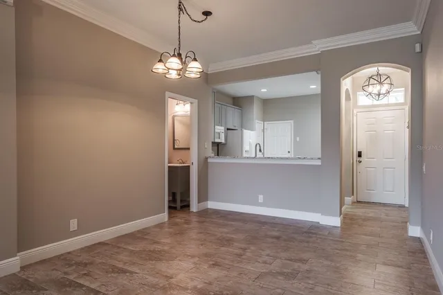 a view of a kitchen with an empty space and a kitchen