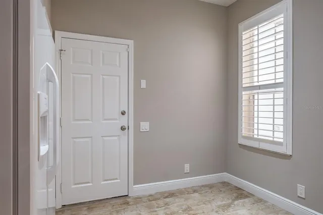 an empty room with windows