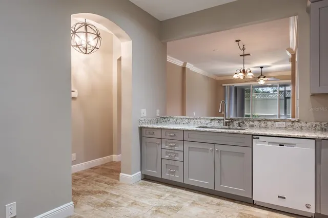 a bathroom with a granite countertop sink a large mirror and a shower