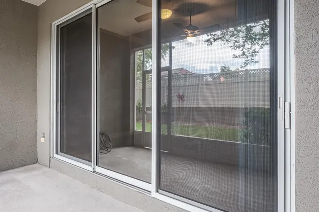 a bathroom with a glass shower door