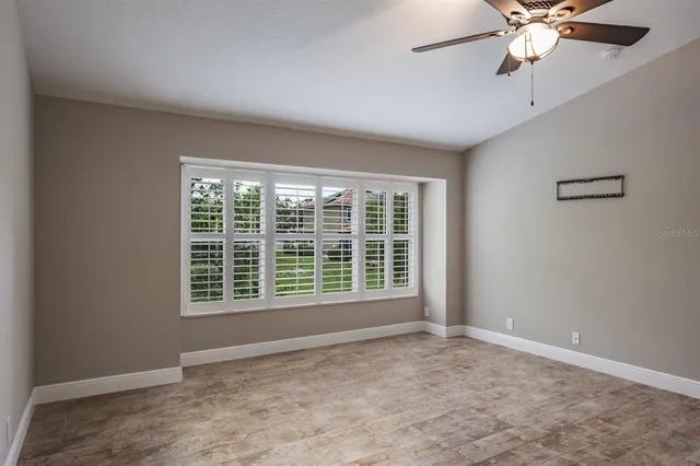 a view of an empty room with a window