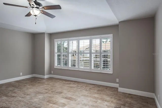 a view of an empty room with a window