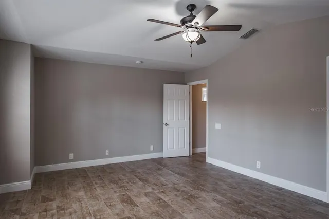 a view of a chandelier fan in a room
