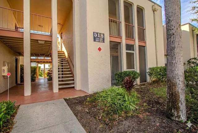 a view of a building with potted plants