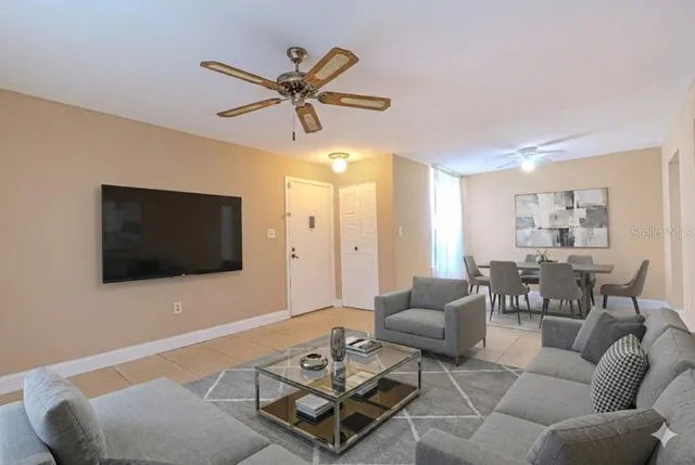 a living room with furniture and a flat screen tv