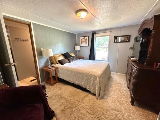 484 Stokes Lane Bath Springs, TN 38311 - Photo 13 of 40 a bedroom with a bed a flat tv screen and a dresser
