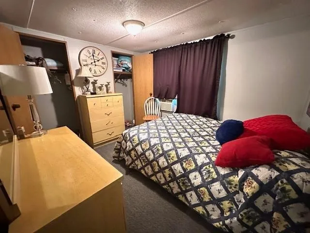 a bedroom with a bed and a table in it