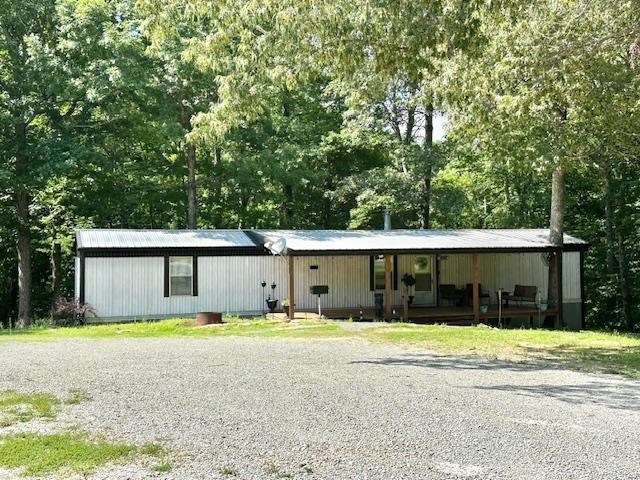 484 Stokes Lane Bath Springs, TN 38311 - Photo 2 of 40 a front view of a house with a yard and garage
