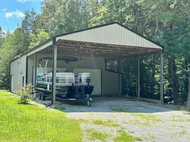 484 Stokes Lane Bath Springs, TN 38311 - Photo 3 of 40 a view of a house with backyard and sitting area