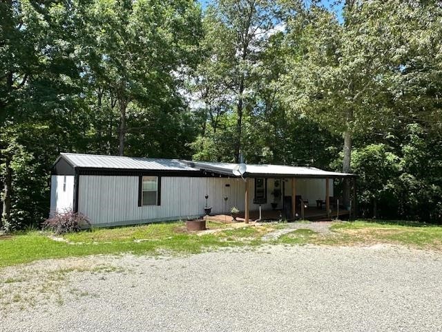 484 Stokes Lane Bath Springs, TN 38311 - Photo 36 of 40 a view of a house with a yard