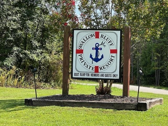 484 Stokes Lane Bath Springs, TN 38311 - Photo 37 of 40 a sign on the side of the building