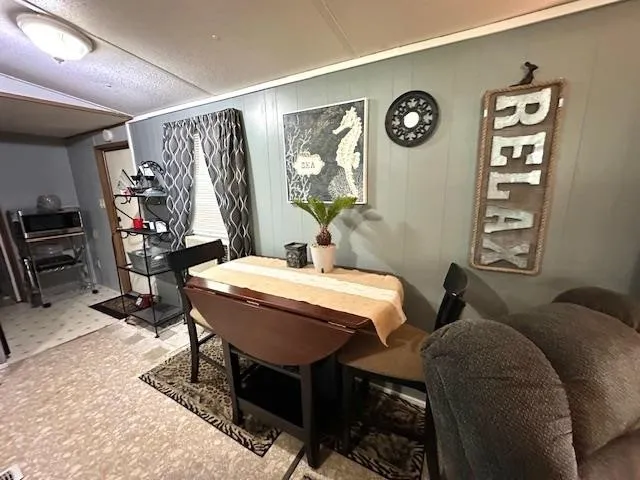 a view of a livingroom with furniture and window