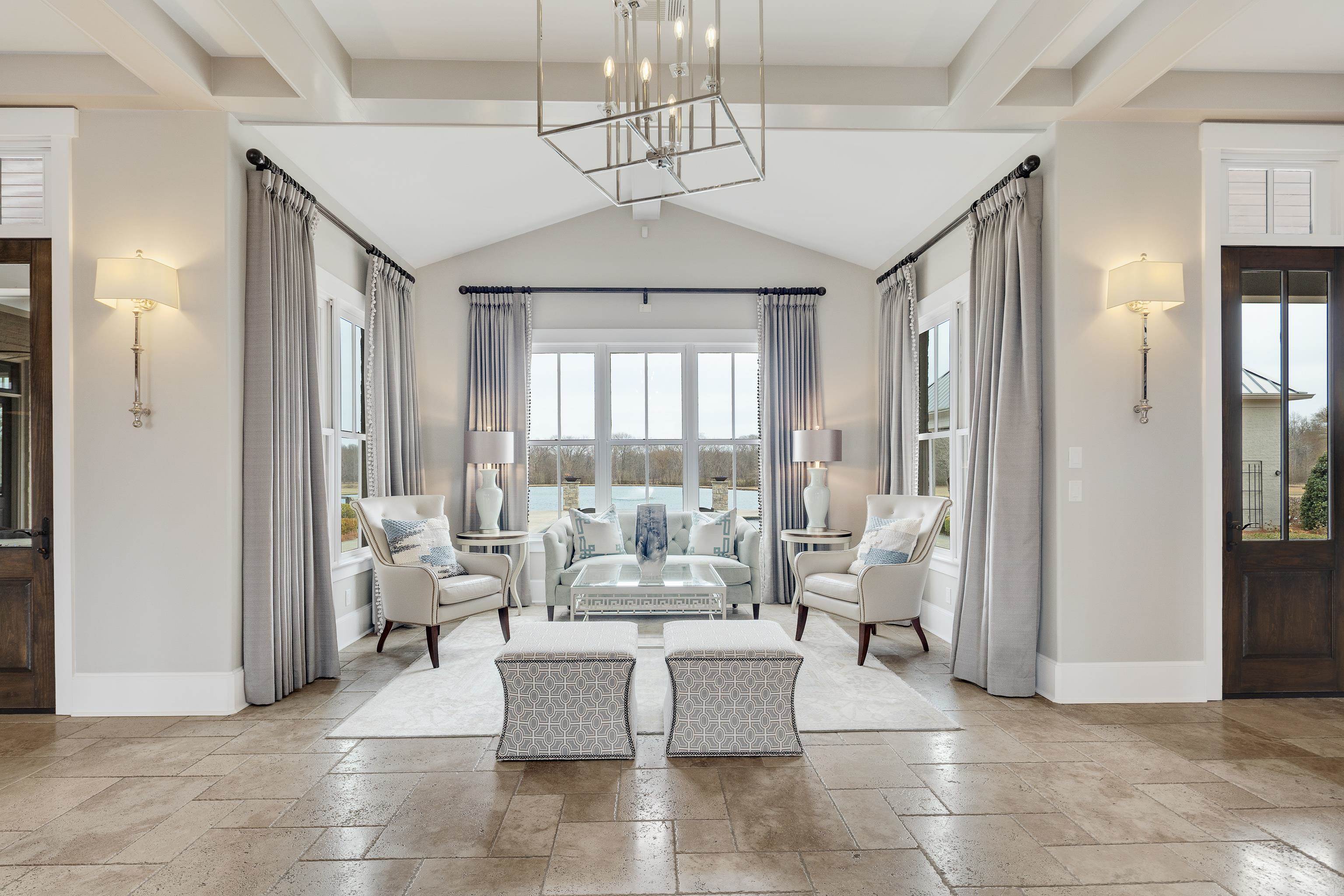 770 Ballard Road Piperton, TN 38017 - Photo 5 of 40 a living room with patio furniture and a chandelier