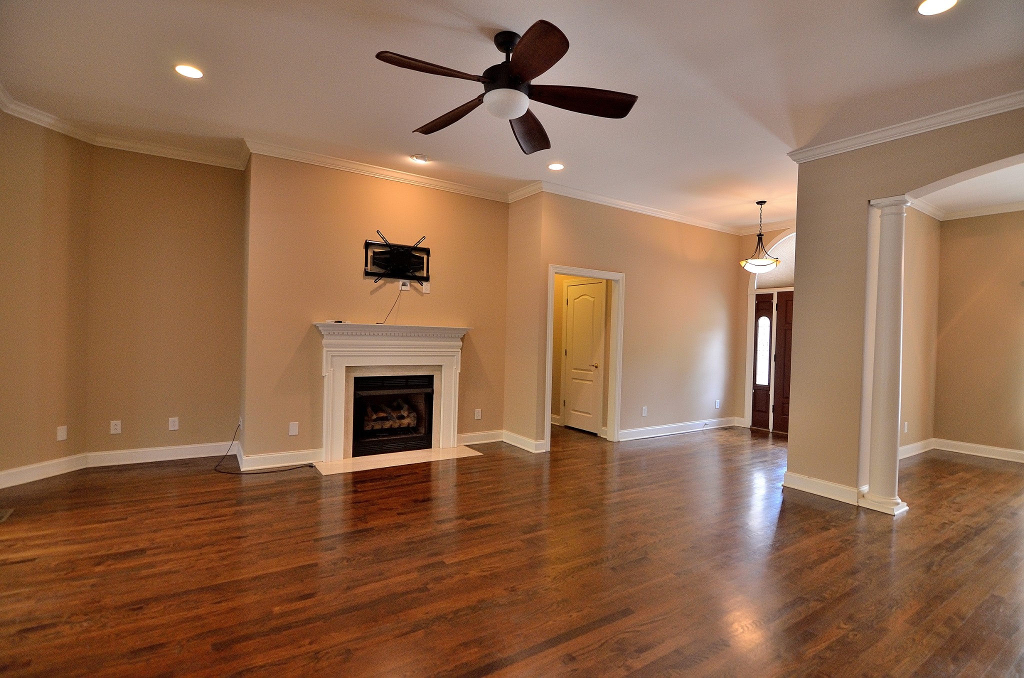 2600 Derby Run Road Springfield, TN 37172 - Photo 12 of 57 a view of a livingroom with a fireplace a ceiling fan and hardwood floor