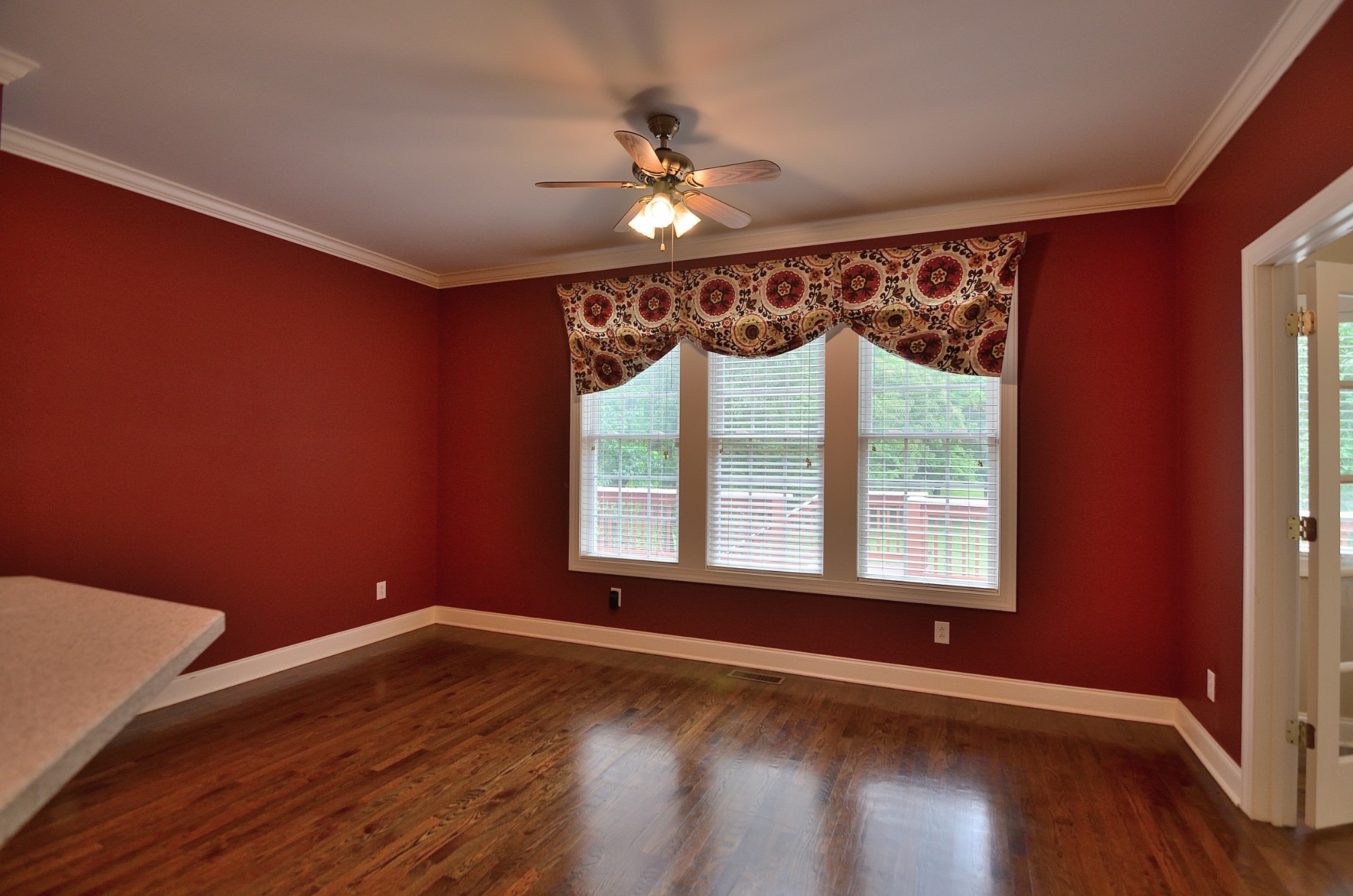 2600 Derby Run Road Springfield, TN 37172 - Photo 21 of 57 a view of an empty room with wooden floor and a window