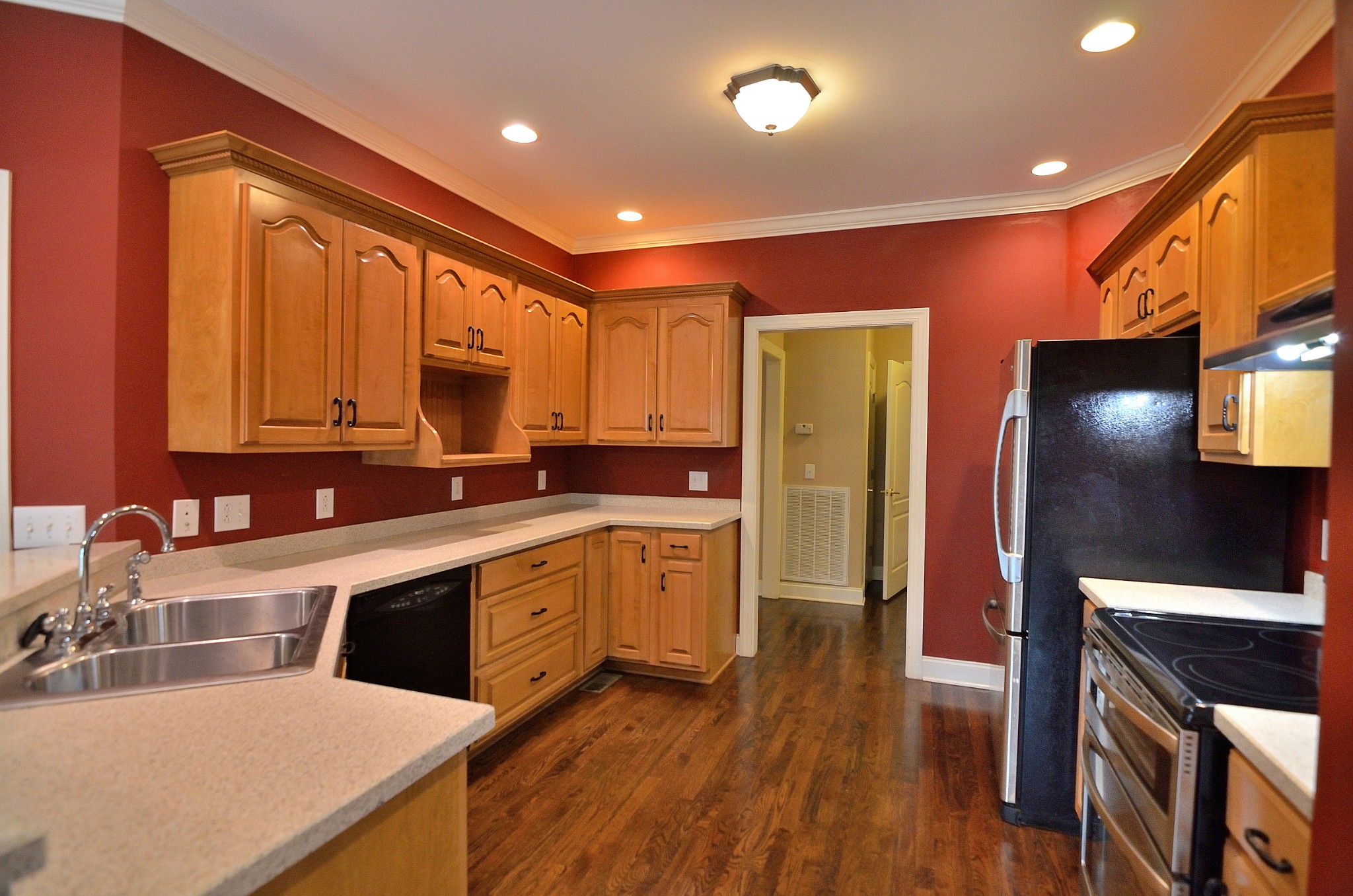 2600 Derby Run Road Springfield, TN 37172 - Photo 26 of 57 a kitchen with stainless steel appliances sink stove refrigerator and wooden floor