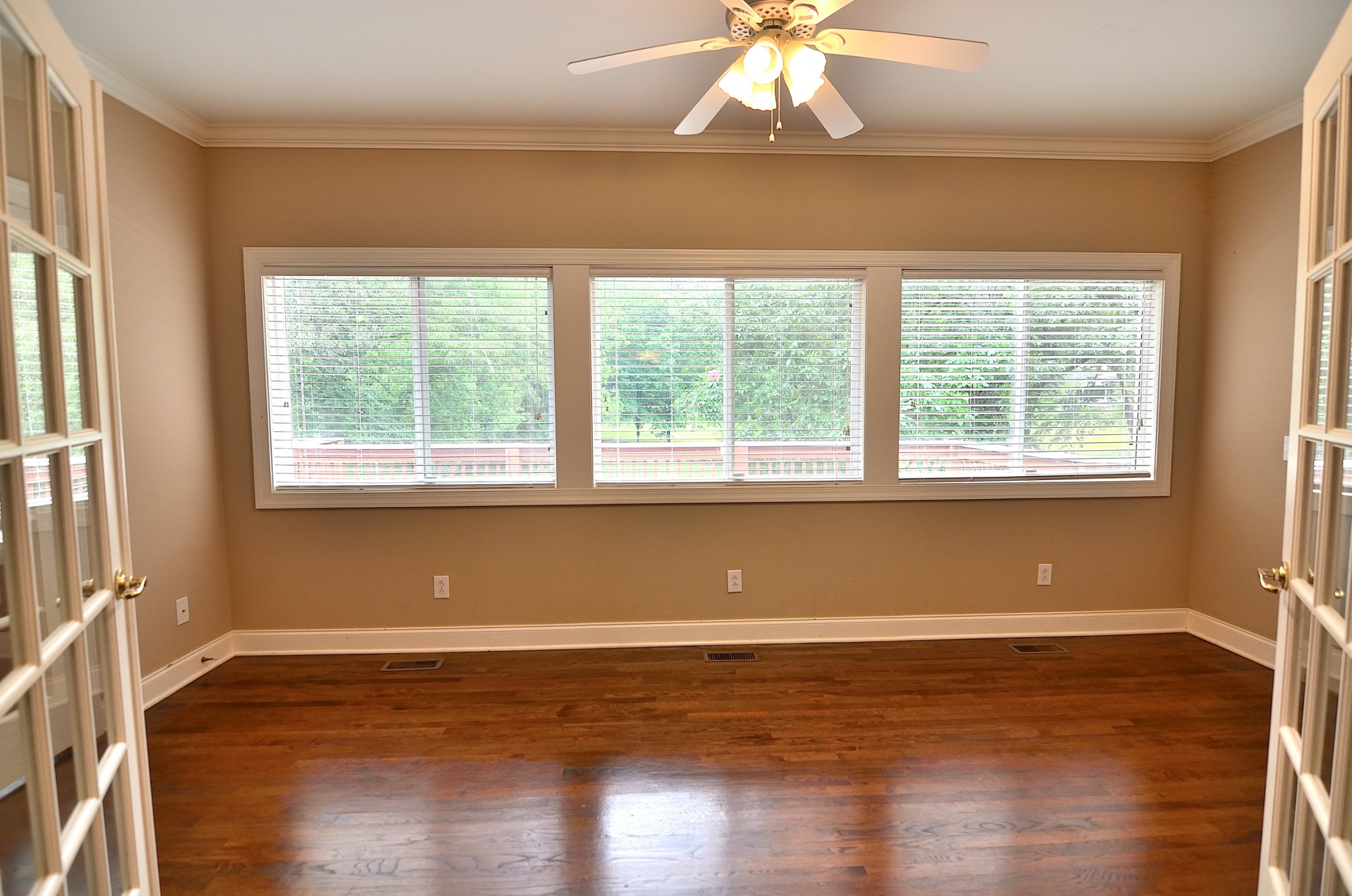 2600 Derby Run Road Springfield, TN 37172 - Photo 32 of 57 a view of empty room with wooden floor and fan