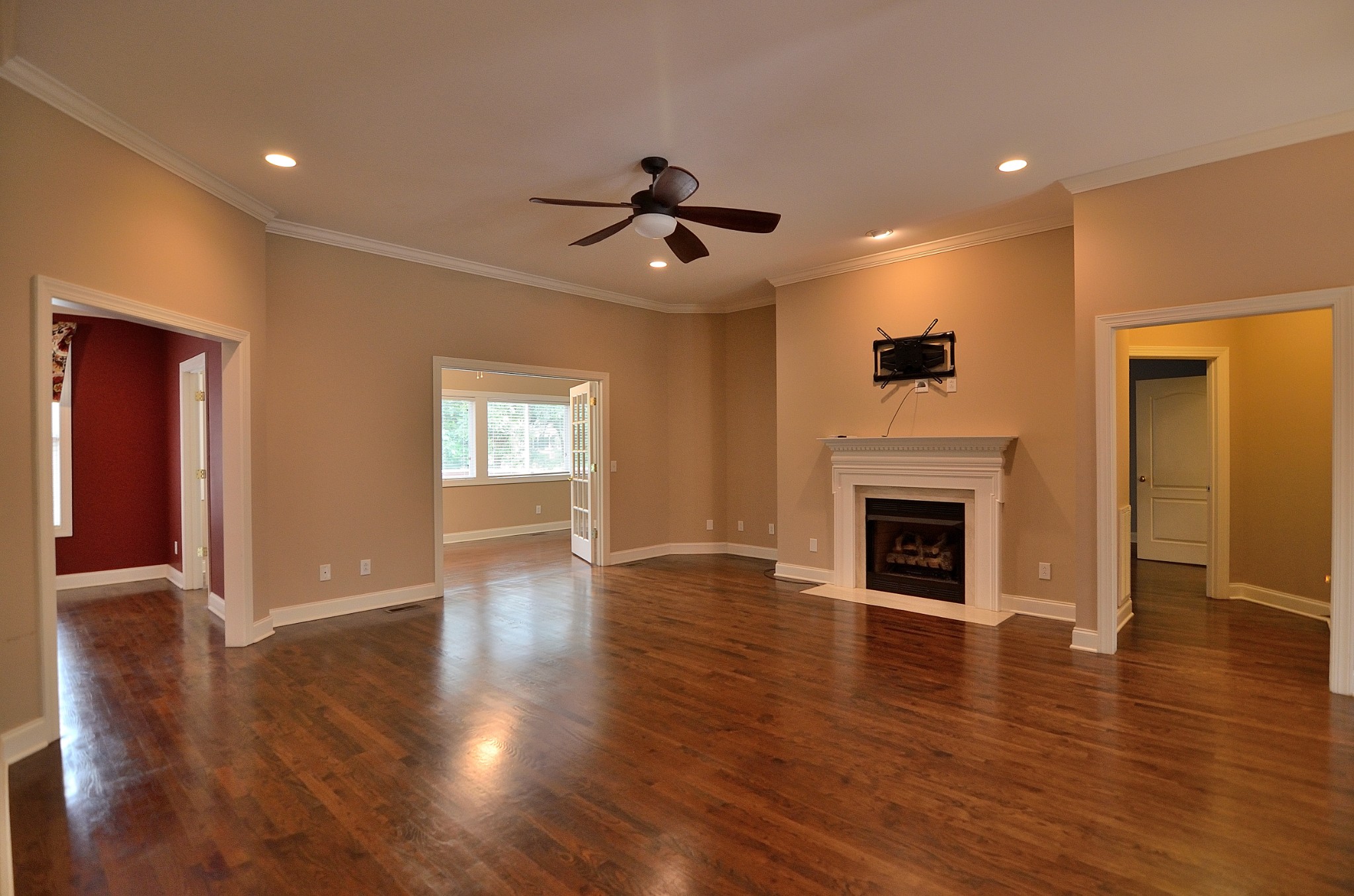 2600 Derby Run Road Springfield, TN 37172 - Photo 6 of 57 a view of an empty room with wooden floor fireplace and a window